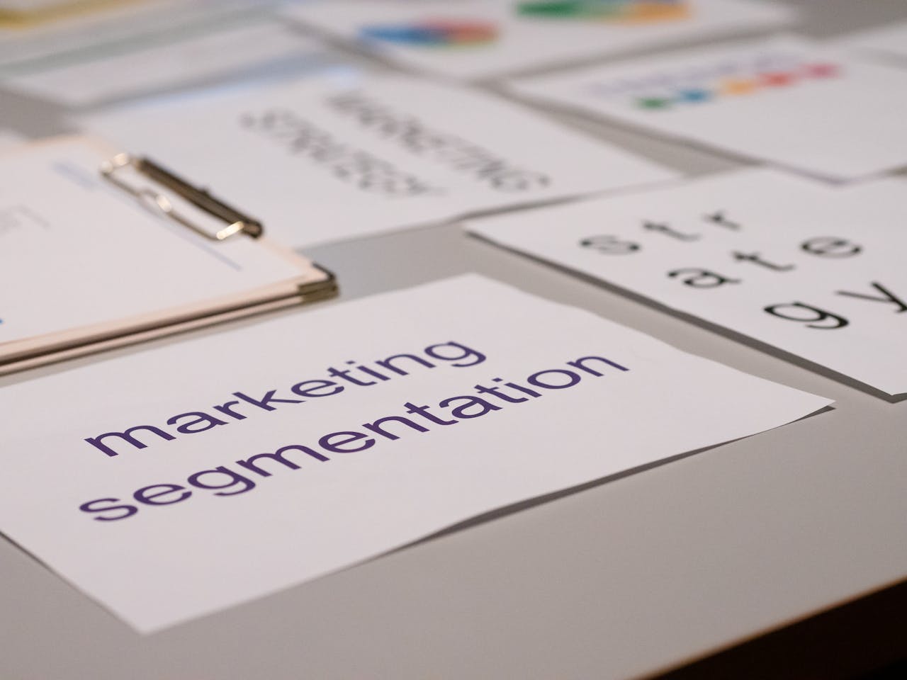 Close-up of various marketing documents on a desk, perfect for business and strategy discussions.